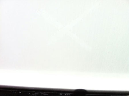 Finger drag across hull produced no particulate